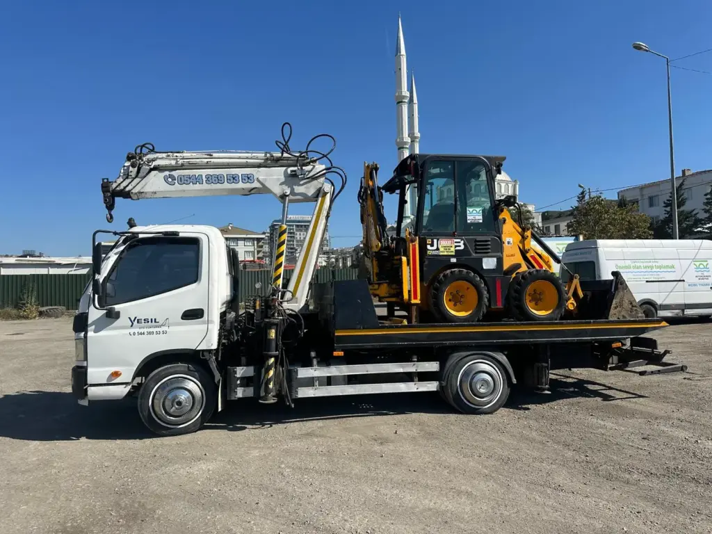 Vinçli kurtarıcı ile kepçe taşıma